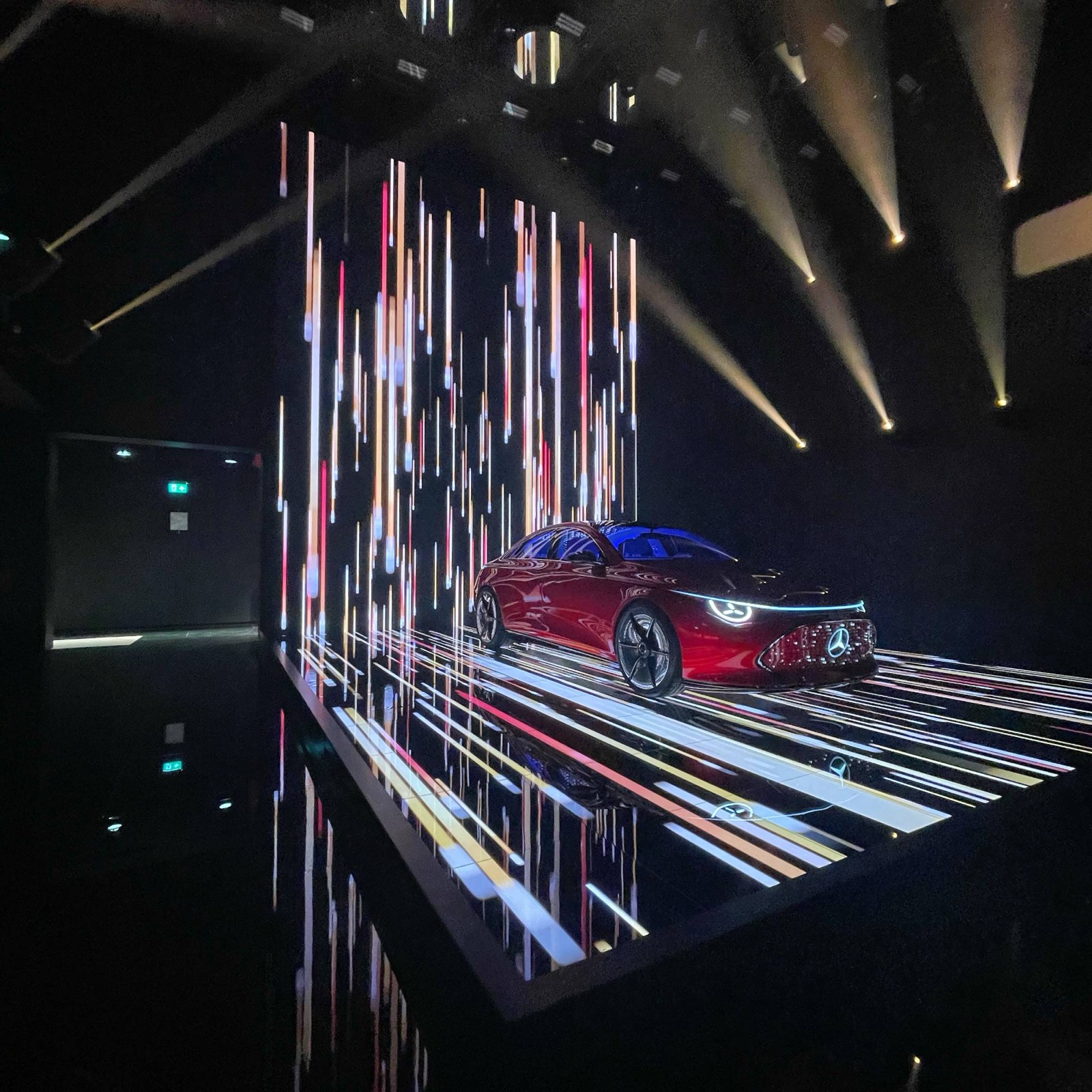 Car on an LED floor in front of an LED wall with light streaks